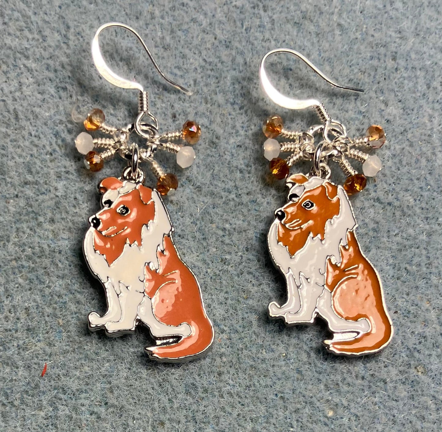 White and brown enamel collie charm earrings adorned with tiny dangling white and brown Chinese crystal beads.