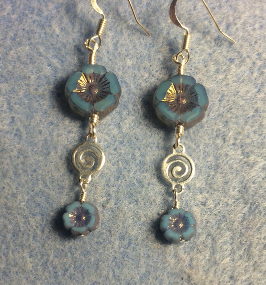 Opaque light blue Czech glass pansy bead earrings adorned with silver swirly connectors and tiny light blue Czech glass pansy beads.