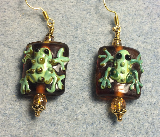 Topaz and green lamp work frog bead earrings adorned with topaz Czech glass beads.