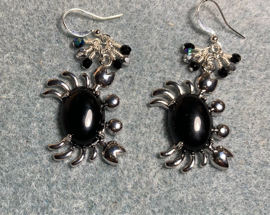 Silver and black onyx gemstone crab charm earrings adorned with small dangling black and silver Czech glass beads.