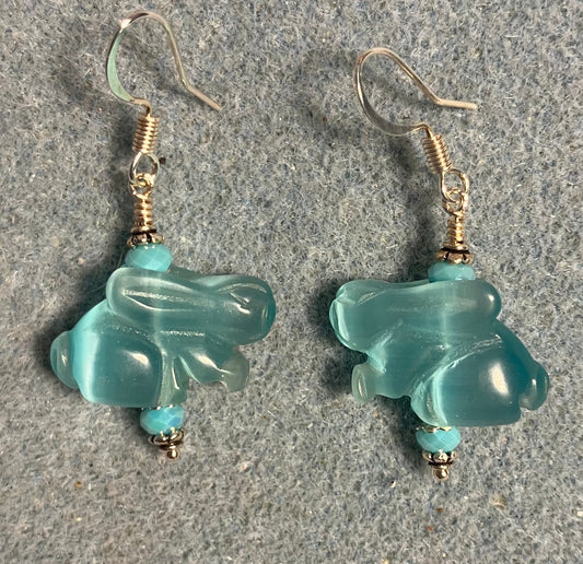 Turquoise fiber optic (cat’s eye) rabbit bead earrings adorned with turquoise Chinese crystal beads.