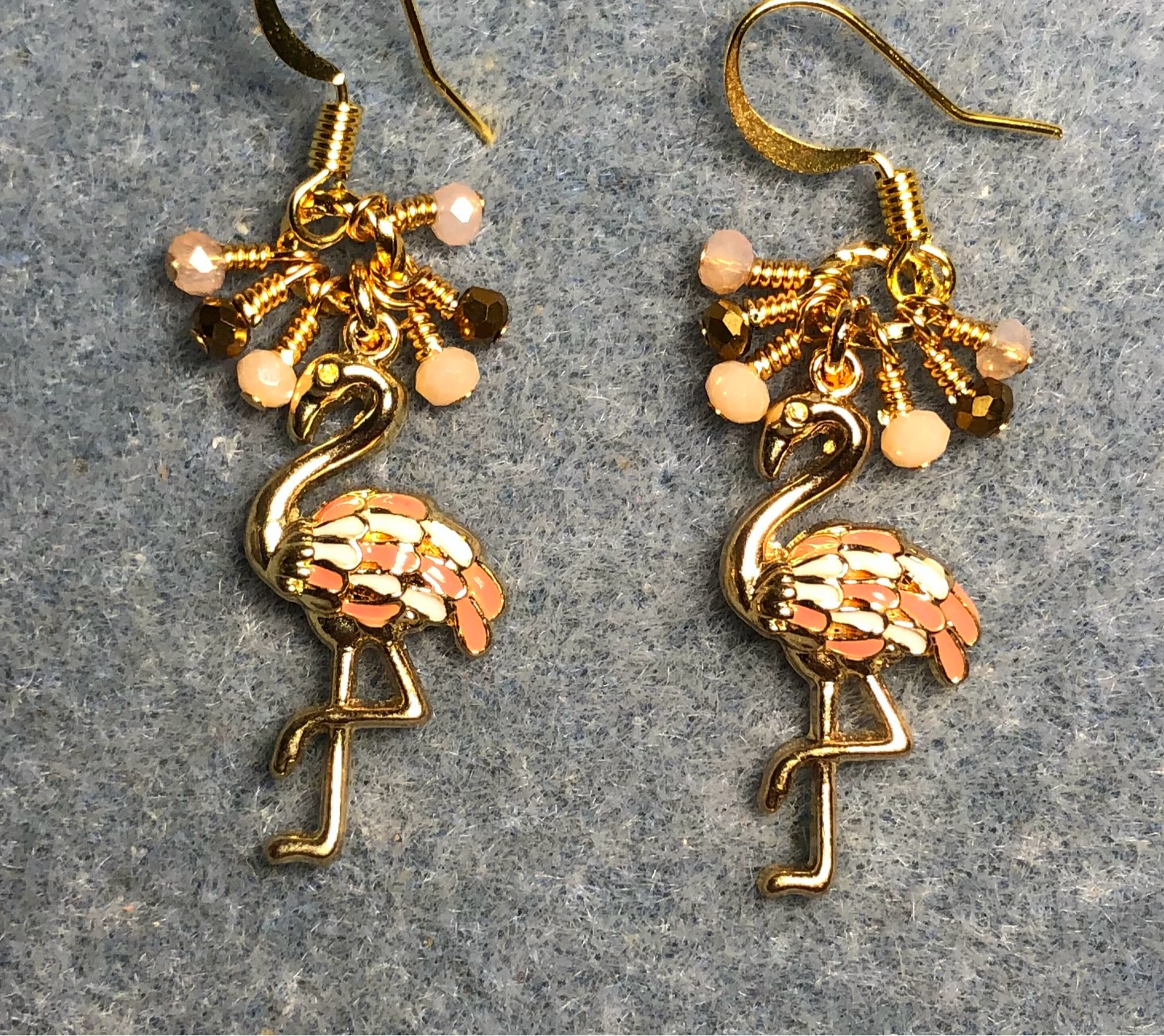 Gold and peach enamel flamingo charm earrings adorned with tiny dangling gold and peach Chinese crystal beads.