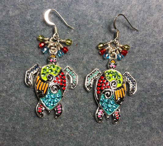 Large silver and colorful rhinestone sea turtle charm earrings adorned with small dangling turquoise, red, and olive green Czech glass beads.