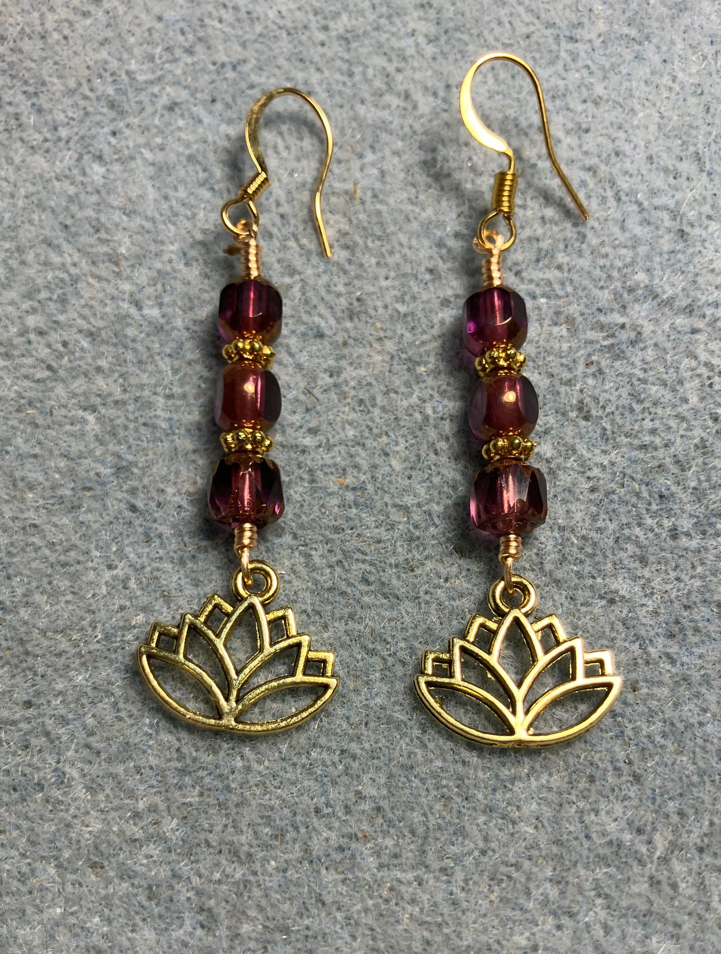 Gold lotus flower charm earrings adorned with purple violet Czech glass beads