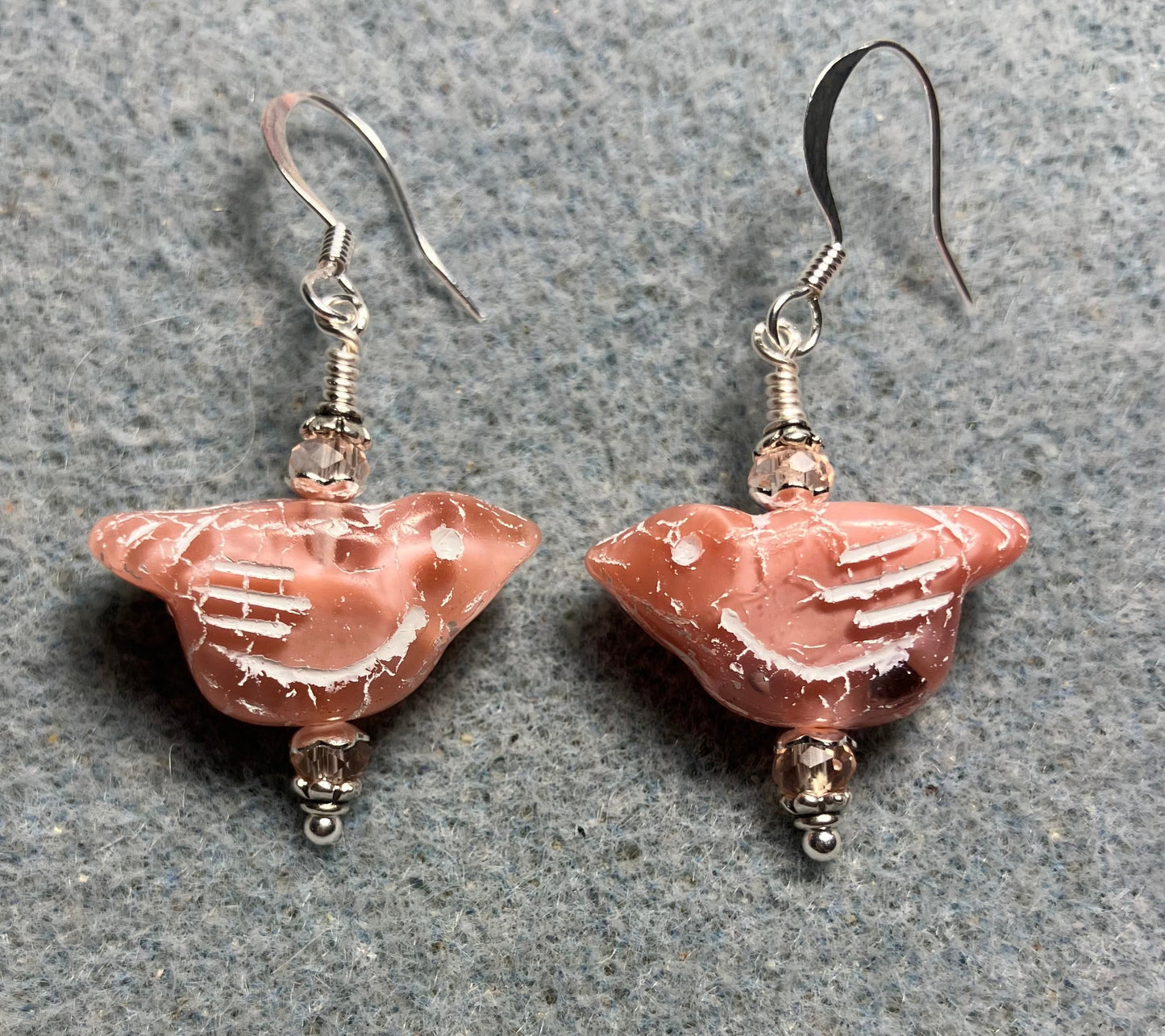 Light pink (with light pink wash) Czech glass bird bead earrings adorned with light pink Chinese crystal beads.