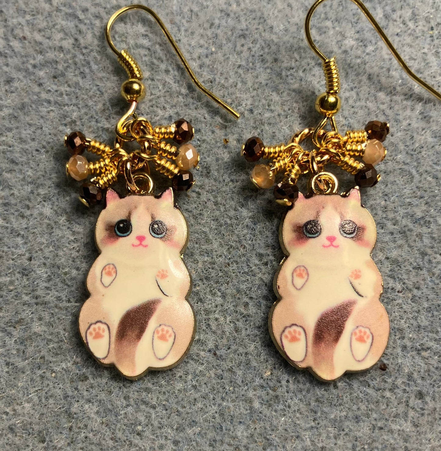 Brown and tan enamel cat charm earrings adorned with tiny dangling brown and tan Chinese crystal beads.