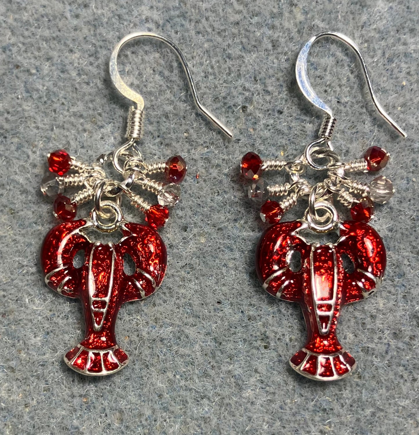 Silver and red enamel lobster charm earrings adorned with tiny dangling red and silver Chinese crystal beads.