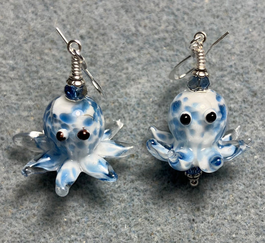 Blue and white mottled lamp work octopus bead earrings adorned with light blue Chinese crystal beads.