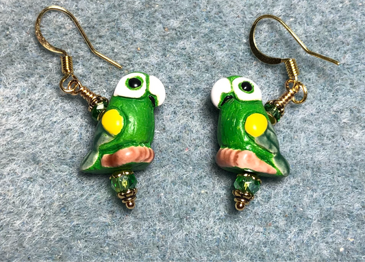 Small green, yellow, and white ceramic parrot bead earrings adorned with green Chinese crystal beads.