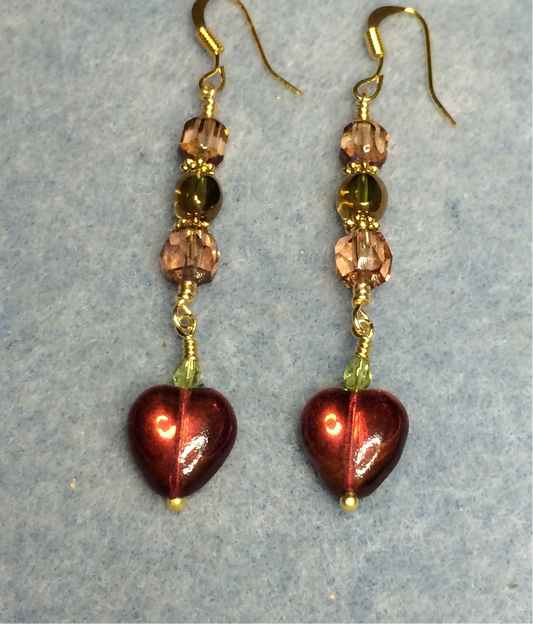 Small burnt orange and olive green Czech glass heart bead earrings adorned with rosaline and olive green Czech glass beads.