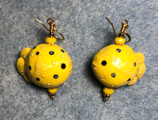 Yellow ceramic blowfish bead earrings adorned with yellow Chinese crystal beads.