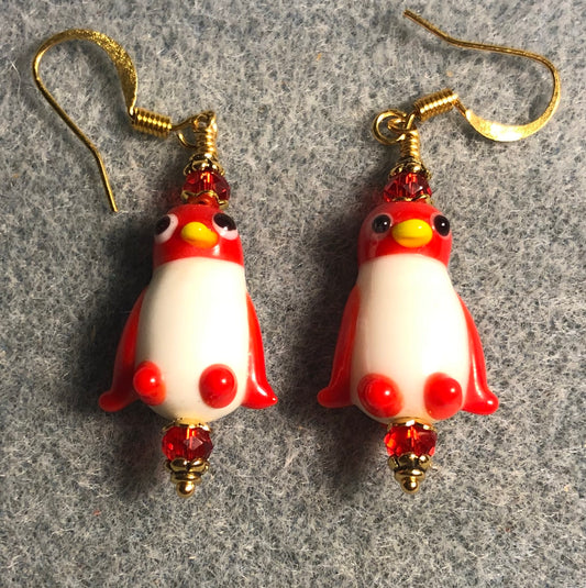 Opaque red and white lamp work penguin bead earrings adorned with red Chinese crystal beads.