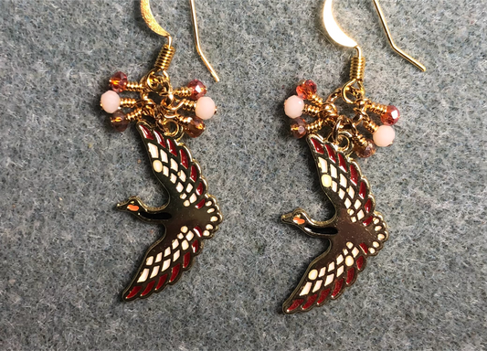 Gold, off white, and orange enamel flying crane charm earrings adorned with tiny amber, off white, and orange Chinese crystal beads.