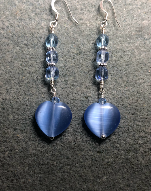 Light blue fiber optic (cat’s eye) Czech glass heart bead earrings adorned with light blue Czech glass beads.