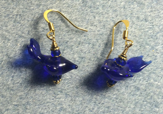 Small dark blue lamp work whale bead earrings adorned with dark blue Chinese crystal beads.