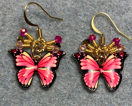 Hot pink and light pink enamel butterfly charm earrings adorned with tiny dangling hot pink, gold, and light pink Chinese crystal beads.