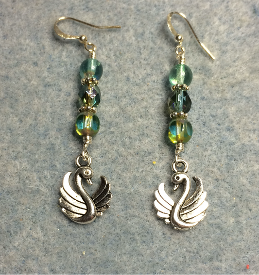 Silver swan charm earrings adorned with blue green Czech glass beads