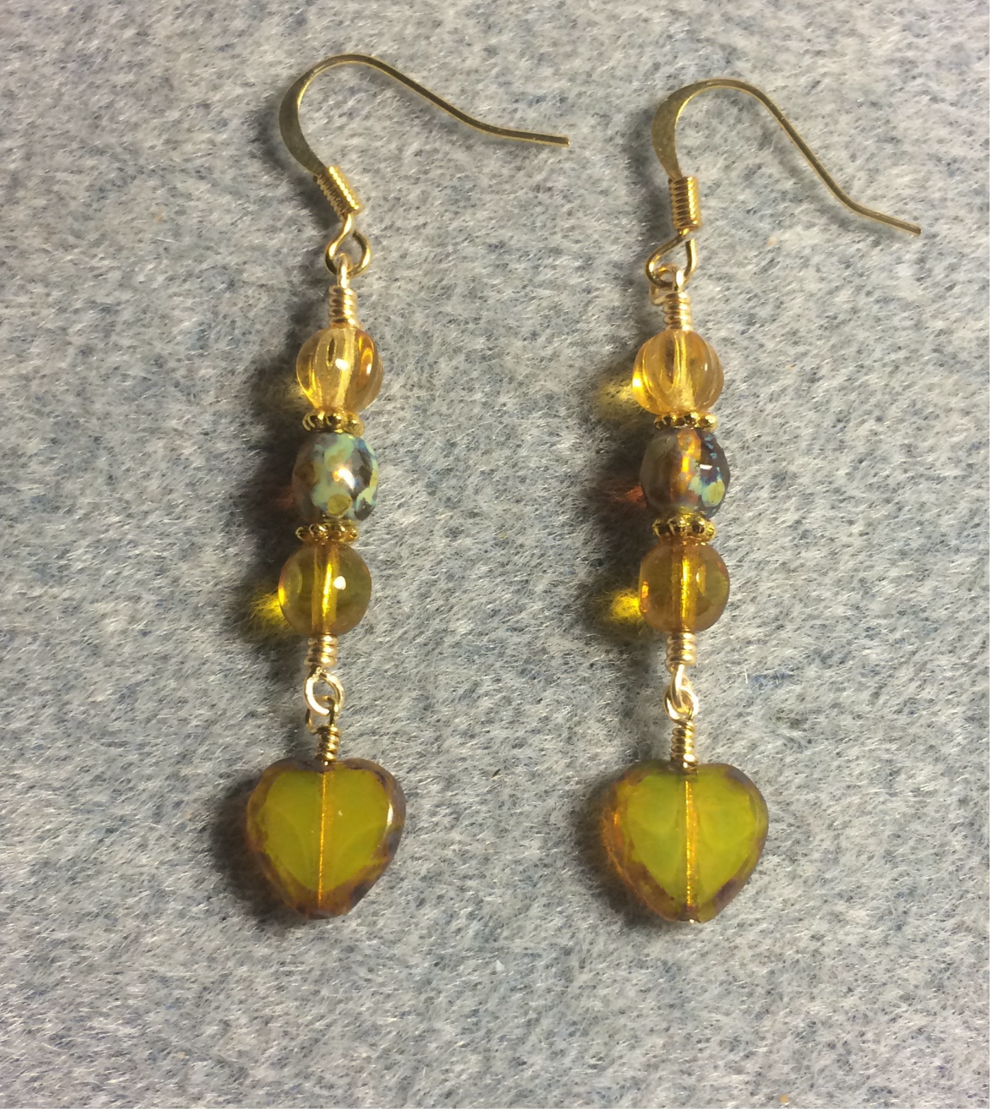 Small amber Czech glass heart bead earrings adorned with amber Czech glass beads.