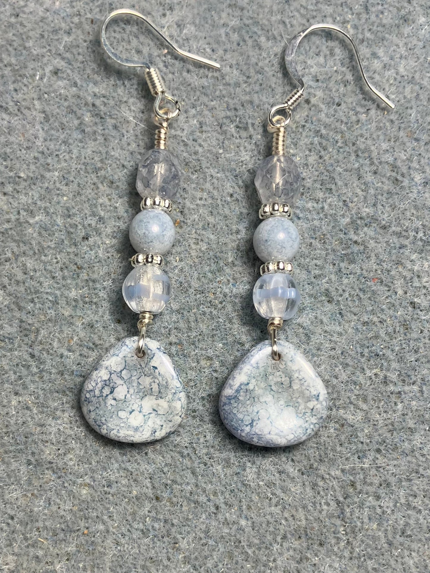 Light blue speckled Czech glass rose petal earrings adorned with light blue Czech glass beads.