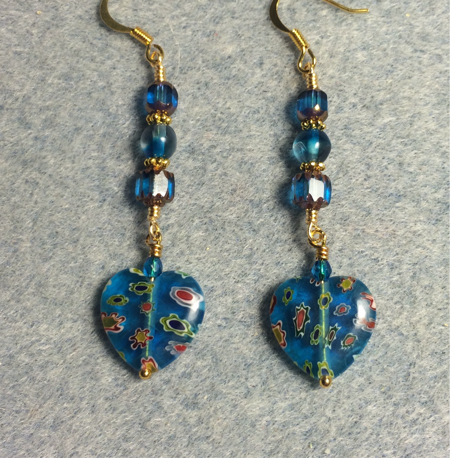 Turquoise millefiori Czech glass heart bead earrings adorned with turquoise Czech glass beads.