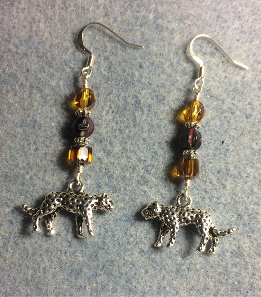 Silver leopard charm earrings adorned with amber and black Czech glass beads