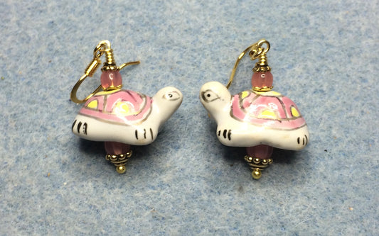 Pink, yellow, and white ceramic turtle bead earrings adorned with pink Czech glass beads.