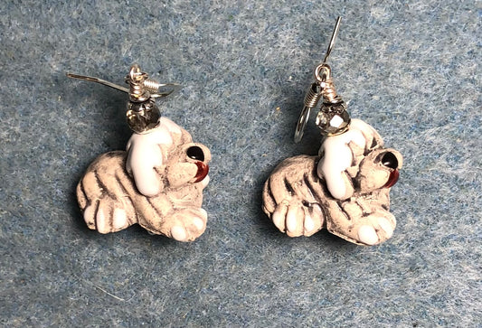 Small beige and white ceramic sheepdog bead earrings adorned with clear Chinese crystal beads.