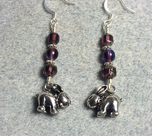 Silver rabbit charm earrings adorned with purple Czech glass beads