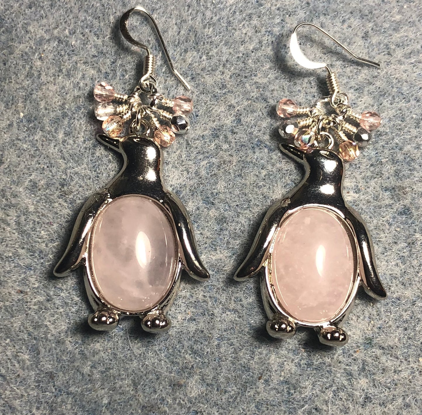 Large silver and pink rose quartz gemstone penguin charm earrings adorned with small dangling pink and clear Czech glass beads.