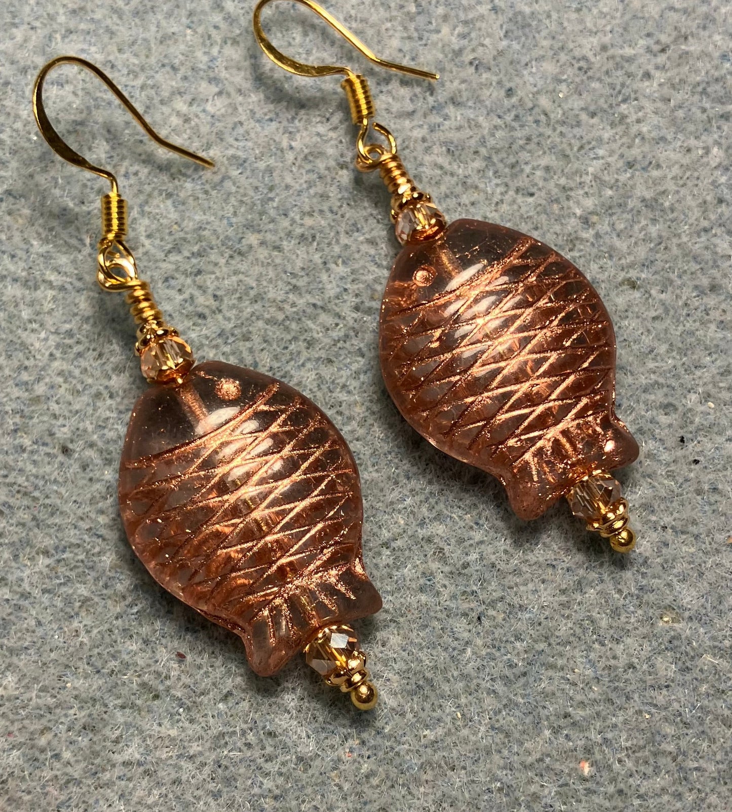 Clear and gold Czech glass fish bead earrings adorned with gold Chinese crystal beads.
