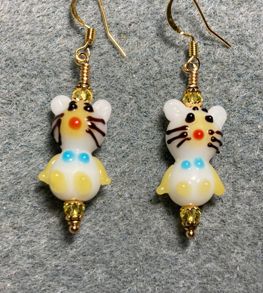 Small white and yellow lamp work cat bead earrings adorned with yellow Chinese crystal beads.