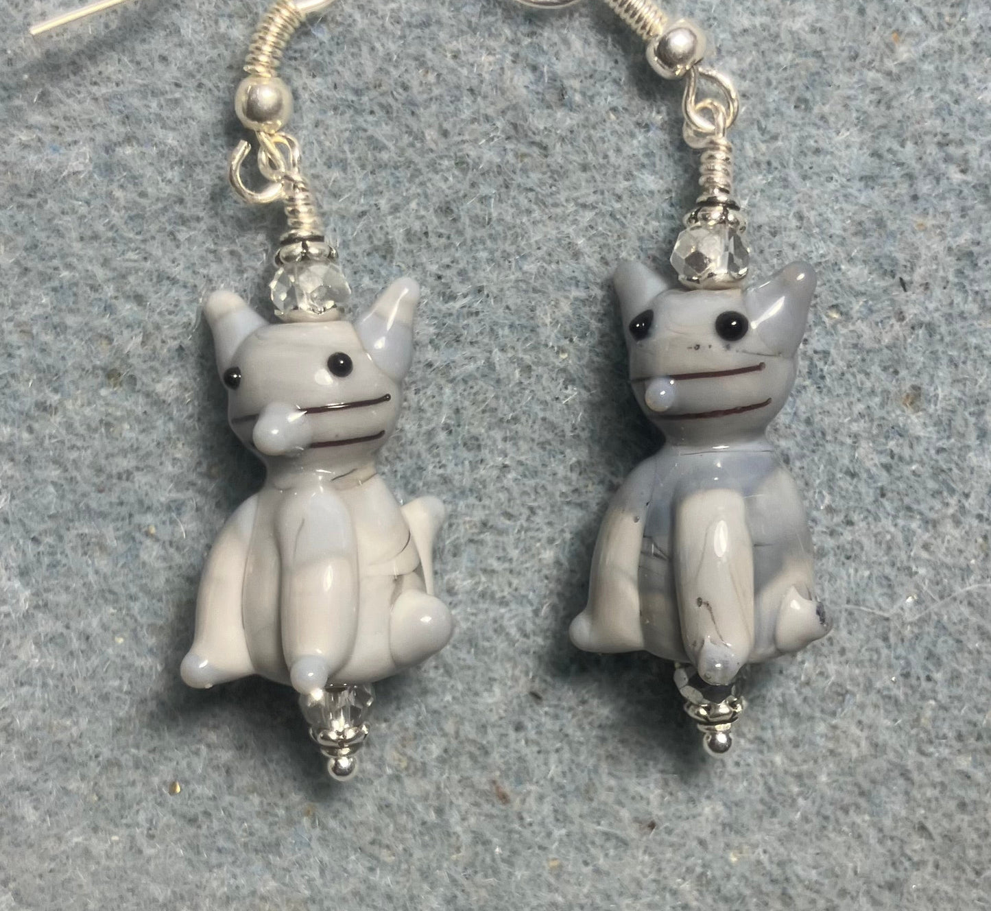 Opaque gray lamp cat bead earrings adorned with clear Chinese crystal beads.