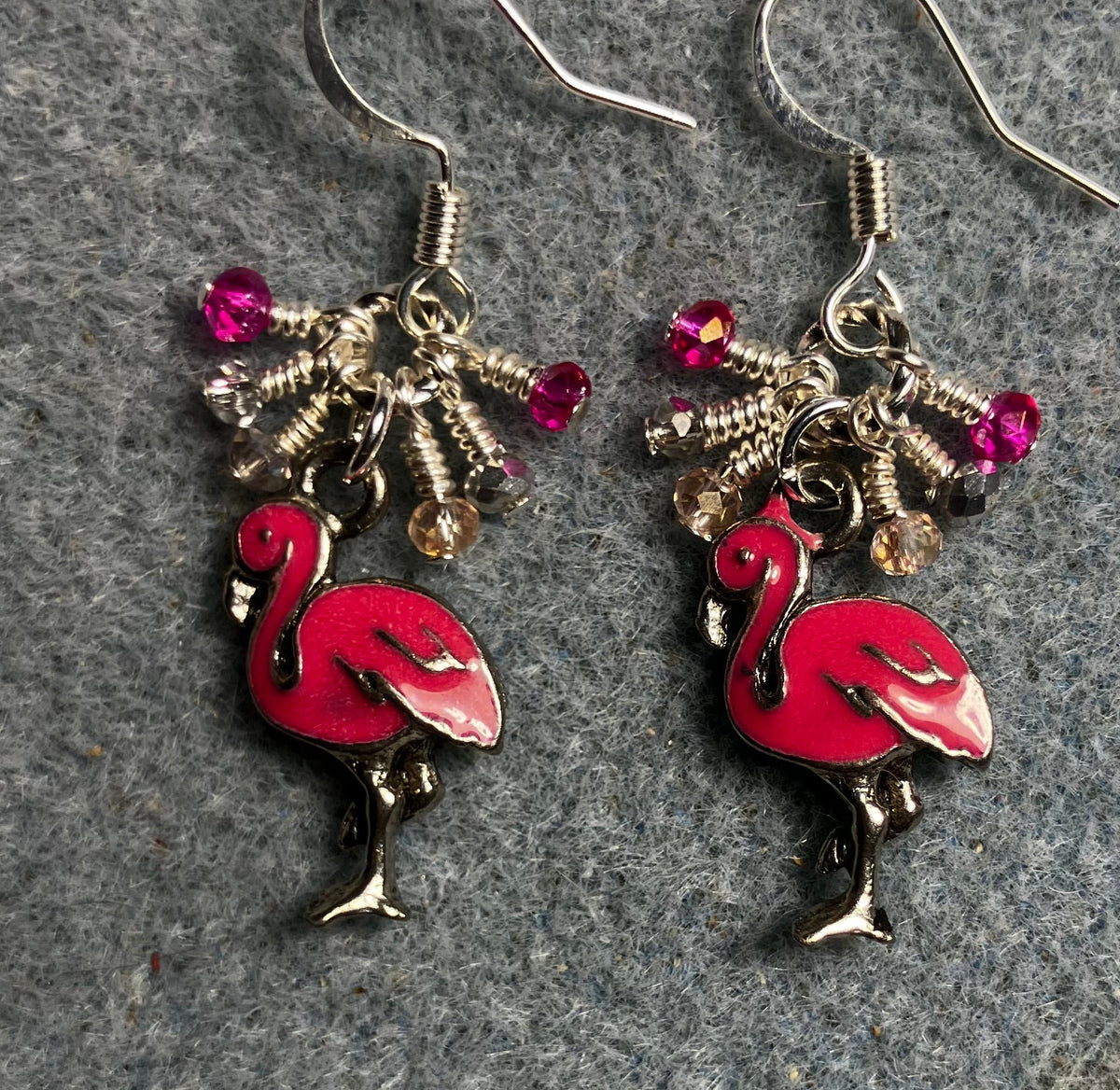 Hot pink enamel flamingo charm earrings adorned with tiny dangling hot pink, light pink, and silver Chinese crystal beads.