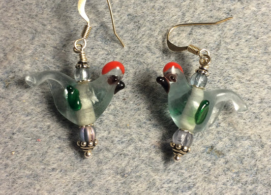 Translucent light blue and green lamp work songbird bead earrings adorned with light blue Czech glass beads.