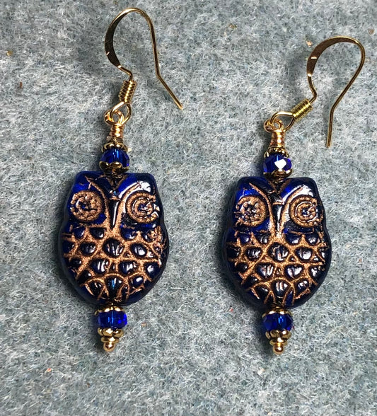 Dark blue (with copper wash) Czech glass owl bead earrings adorned with dark blue Chinese crystal beads.