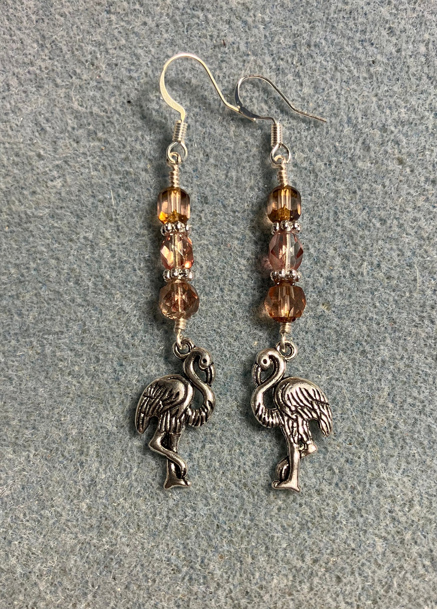 Silver flamingo charm earrings adorned with rose gold Czech glass beads