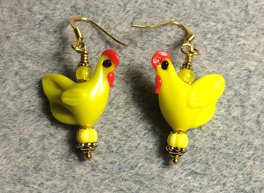 Bright yellow lamp work chicken bead earrings adorned with  bright yellow Czech glass beads.