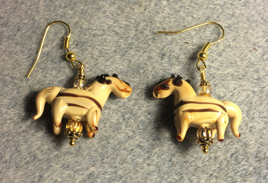 Tan and brown stripes lamp work horse bead earrings adorned with tan Czech glass beads.