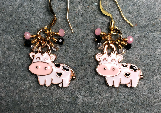 White, pink, and black enamel cow charm earrings adorned with tiny dangling pink and black Chinese crystal beads.
