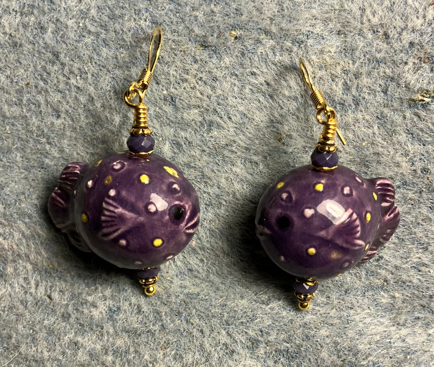 Purple ceramic blowfish bead earrings adorned with purple Chinese crystal beads.