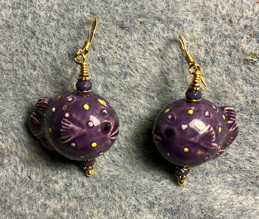 Purple ceramic blowfish bead earrings adorned with purple Chinese crystal beads.