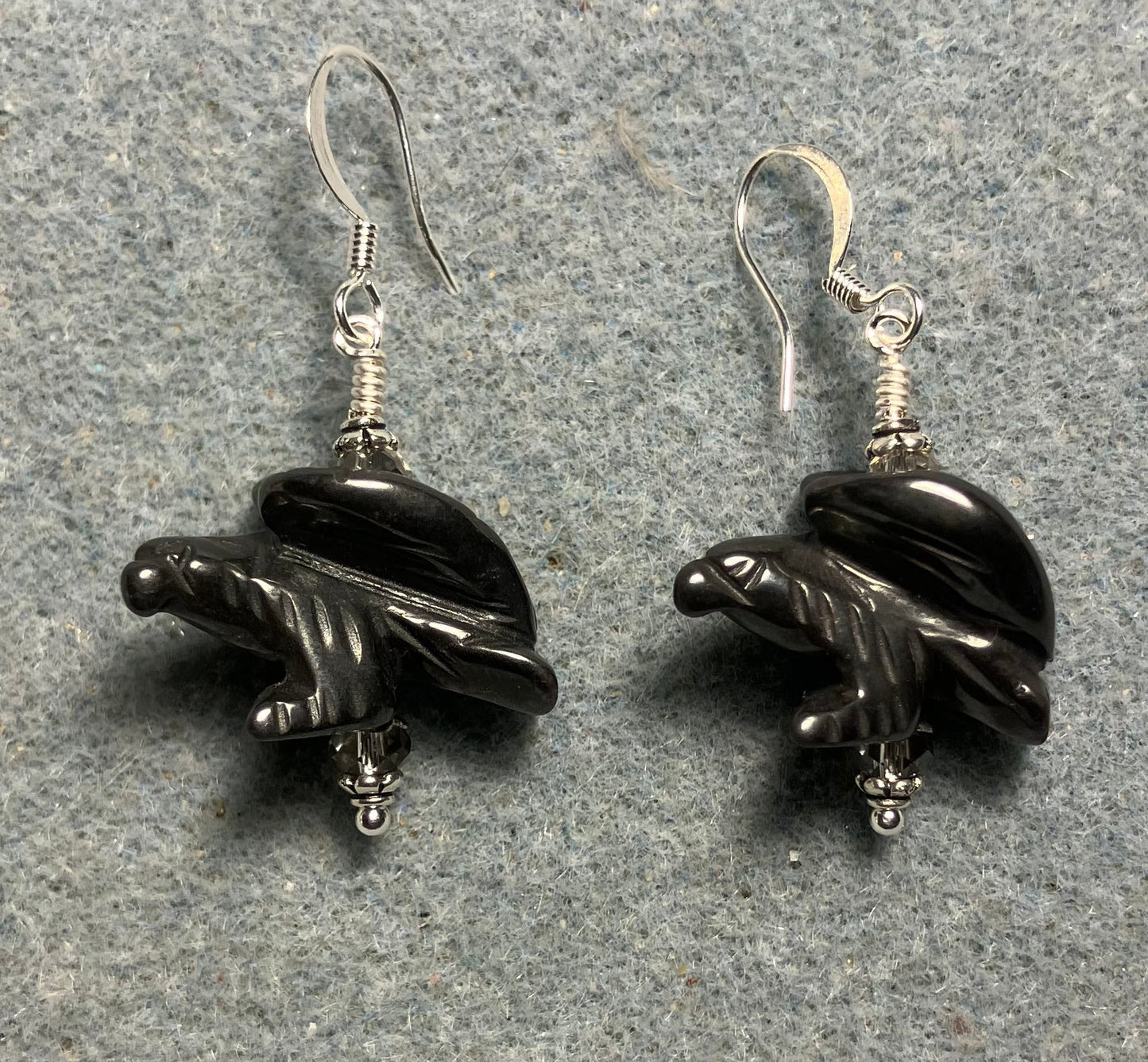 Large gray hematite gemstone flying eagle bead earrings adorned with gray Chinese crystal beads.
