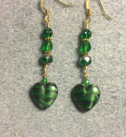 Opaque emerald green Czech glass heart bead earrings adorned with emerald green Czech glass beads.