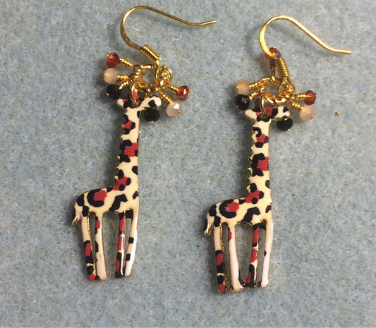 Tan, orange, and black enamel spotted giraffe charm earrings adorned with tiny dangling tan, orange, and black Chinese crystal beads.