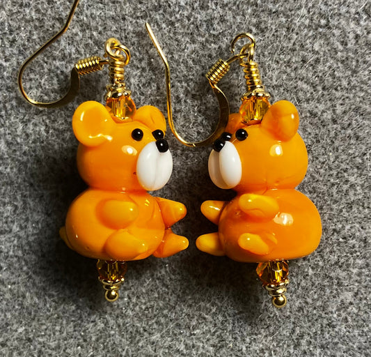 Tangerine and white lamp work teddy bear bead earrings adorned with tangerine Chinese crystal beads.