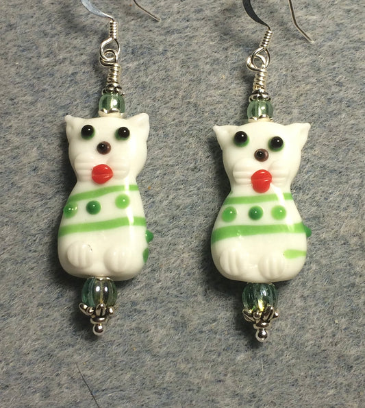 White, green, and orange lamp work cat bead earrings adorned with green Czech glass beads.