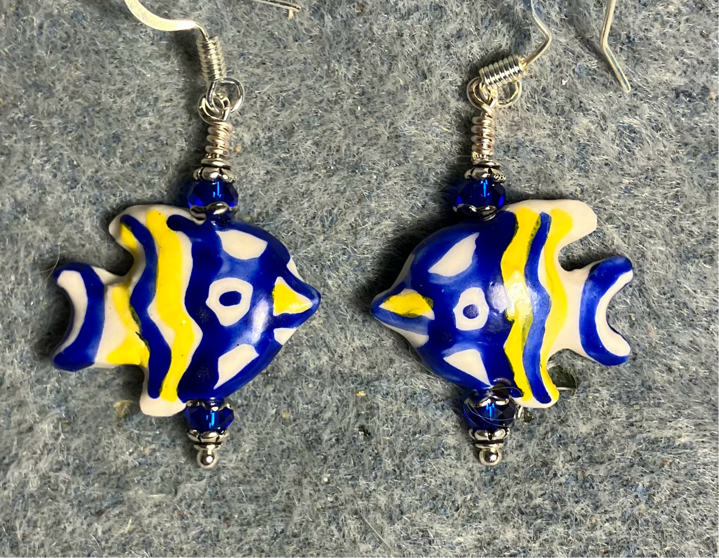 Dark blue and yellow ceramic angelfish bead earrings adorned with dark blue Chinese crystal beads.