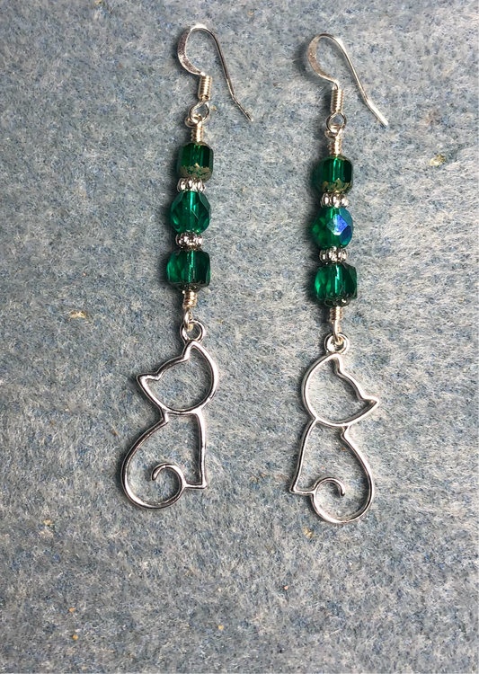 Silver silhouette cat charm earrings adorned with teal Czech glass beads.