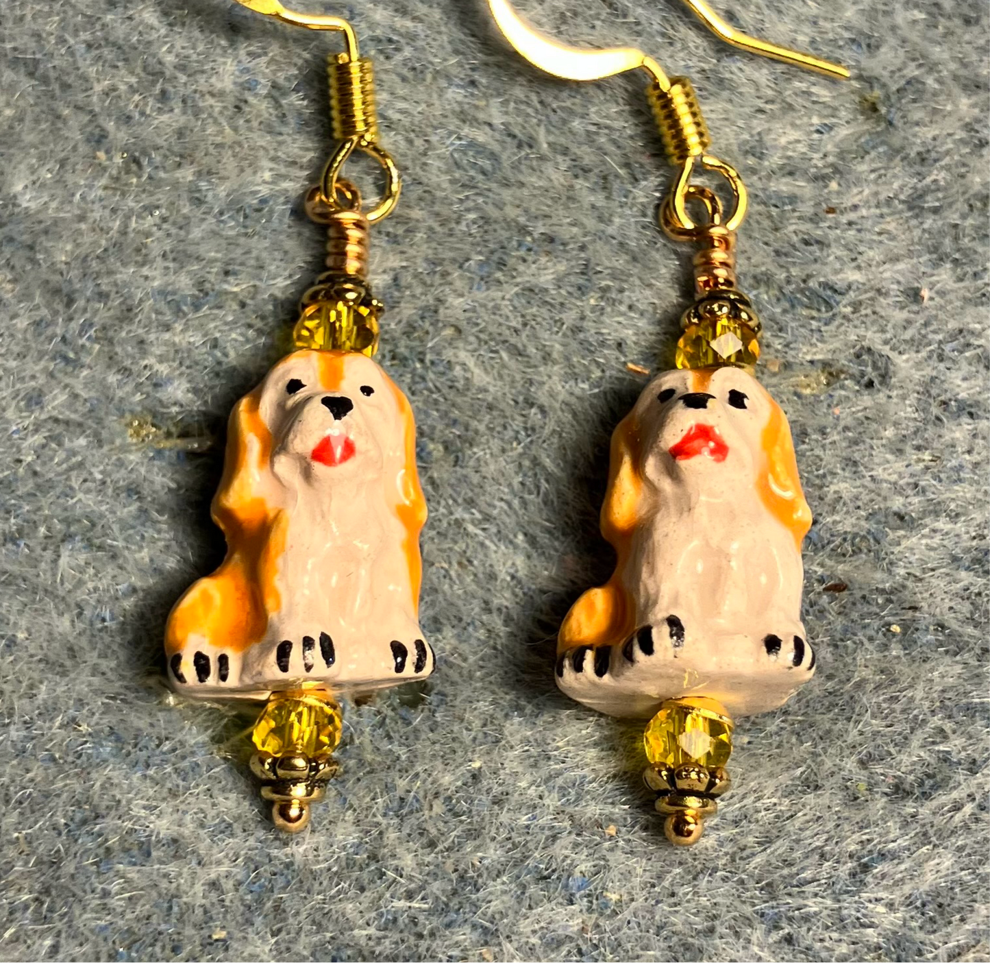 Small tangerine and beige ceramic puppy dog bead earrings adorned with tangerine Chinese crystal beads.