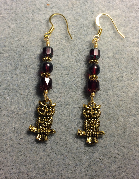Gold owl charm earrings adorned with dark red Czech glass beads